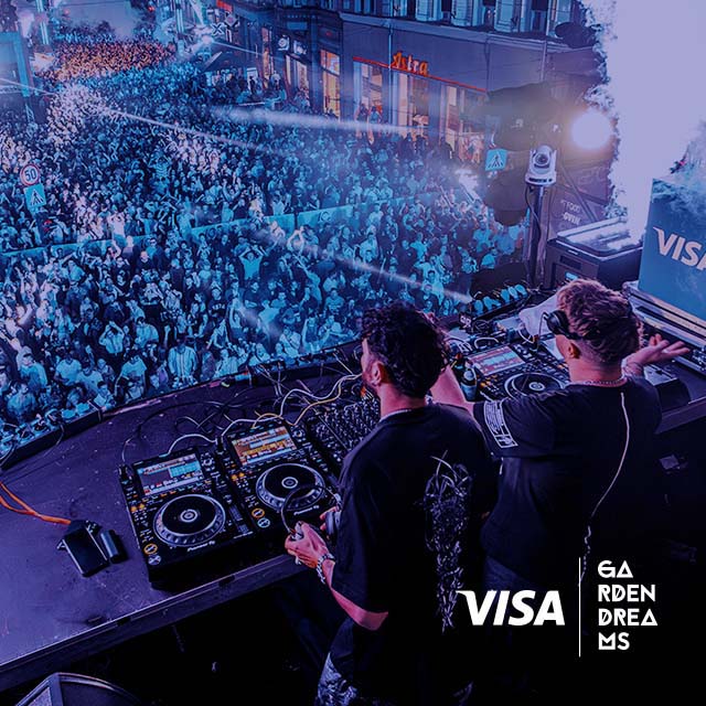 DJs play in front of the crowd